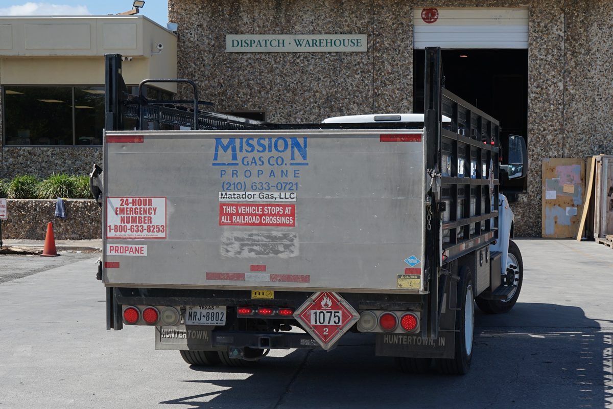Mission Gas Co propane delivery truck parked at warehouse dispatch dock