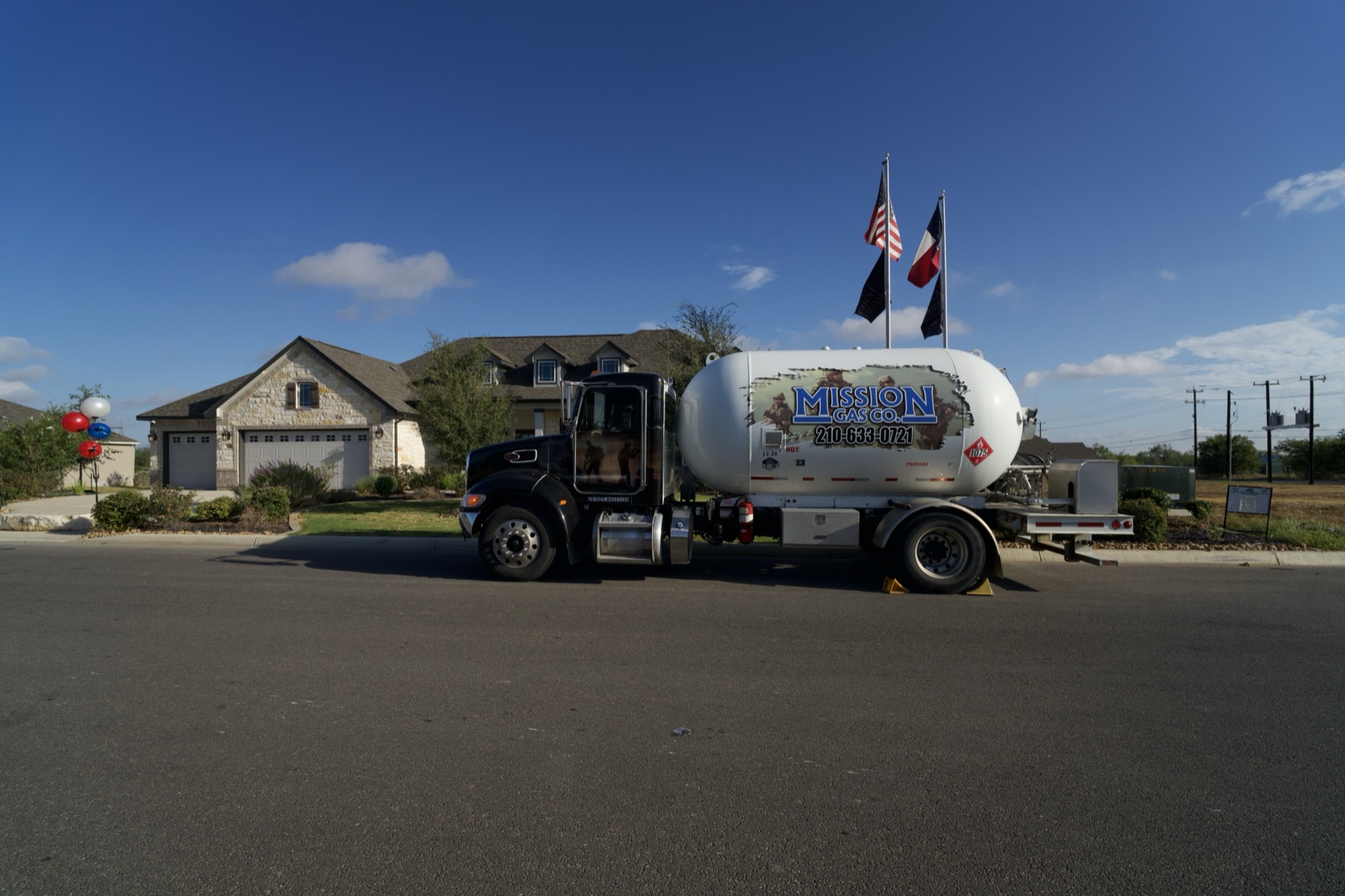 Live Oak, TX propane delivery truck parked in front of a residential property